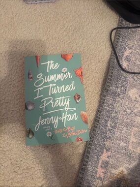 & Other Stories Teal Book Cover with Coral Shell Accents